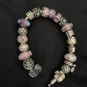 Pandora bracelet, 18 pandora charms, pink, purple and silver color scheme.
